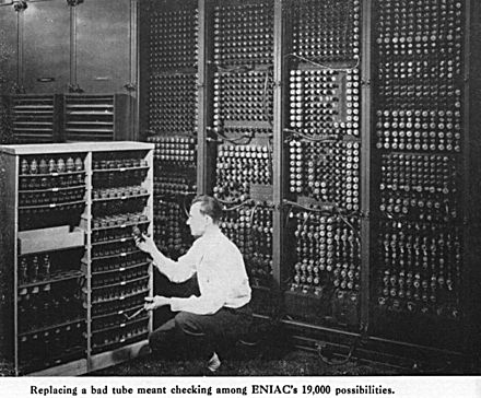 Glenn A. Beck is changing a tube in ENIAC.