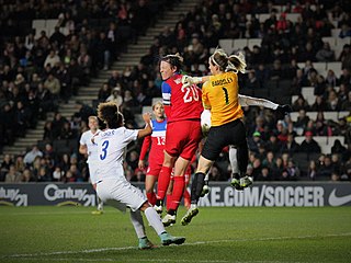 Bardsley defends against Abby Wambach during a match against the United States, February 2015. England Women's Vs USA (16365797348).jpg