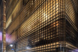 Exterior view of the illuminated facade of Maison Hermès, Ginza, Tokyo, Japan