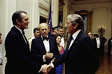 Fraser at a White House state dinner in 1976, being introduced to actor Gregory Peck by President Gerald Ford. Fraser - Ford - Peck.jpg