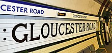 The dark green and cream tiled walls of the Piccadilly line's lower level passages and platforms have been restored. Gloucester Road Picadilly.jpg
