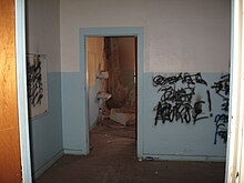 The interior of a vacant building showing signs of vandalism and decay Granger Nurse.jpg