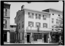 The Nassau Inn (original location) in 1937, showing the west wing, built 1756, and part of the east wing, Mansion house, built 1846 by Charles Steadman Historic American Buildings Survey Nathaniel R. Ewan, Photographer May 25, 1937 EXTERIOR - SOUTH ELEVATION - Nassau Inn, Princeton, Mercer County, NJ HABS NJ,11-PRINT,8-1.tif