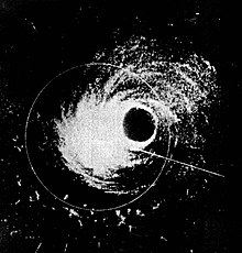 Black and white image showing areas of rainfall within the——hurricane in white. The eye of the 
