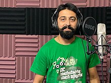 Image of Adarsh Iyengar recording a music in studio.jpg