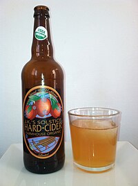 A hard cider produced in Michigan, U.S. JK Scrumpy cider bottle and glass.jpg