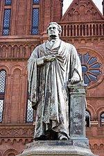 A statue of Joseph Henry is displayed in front of the building. JosephHenry-SmithsonianCastle-20050517.jpg