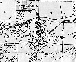 1976: Kaibab National Forest highway map marking Cucamonga Junction, the only residential occupation area in the district.[1] Most homes were evicted and demolished in the 1970s; the remaining holdouts were eliminated by the end of the 1990s. Sections 9 and 10 are designated as "Cucamonga quarries" in recent resource[2][3][4] and environmental damage surveys.[citation needed] 1962 : Residences among the quarries;[5][6] the blue pin next to the church marking the Cucamonga Junction GNIS entry.[7]