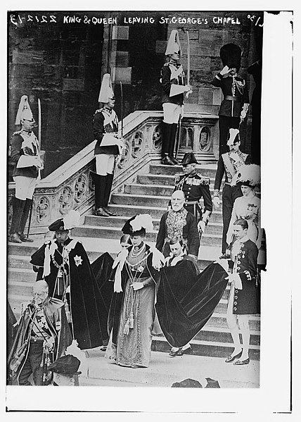 George V and Queen Mary are attended by Pages of Honour in 1911 as they leave St George's Chapel, Windsor Castle