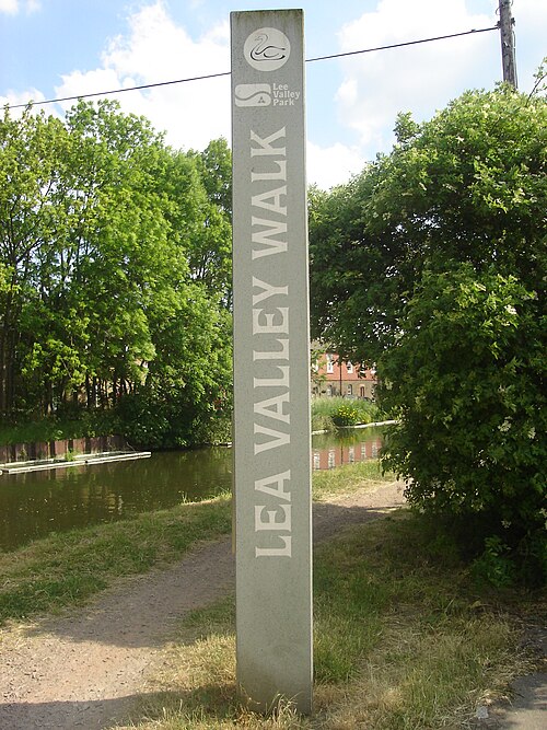 Signpost above Enfield Lock. A glimpse of Government Row in the background. Note the variant spellings of the river