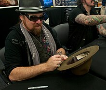 Keys signing autographs with Lynyrd Skynyrd in 2012 Lynyrd Skynyrd visits Fort Jackson (Image 13 of 21).jpg