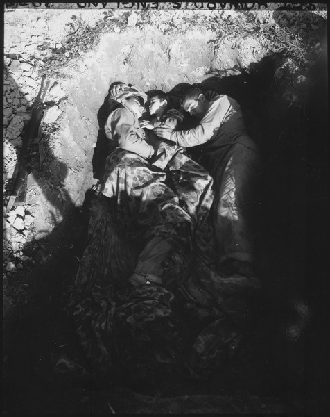 File:Marine Corporal Earl Brunitt (left) and Private Genare Nuzzi share a foxhole and a couple of ponchos on Okinawa with... - NARA - 532551.tif