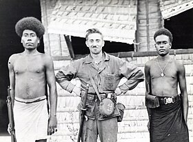 A Marine corporal with two Guadalcanal police officers Marine and Two Guadalcanal Policemen.jpg