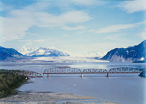 Miles Glacier Bridge in the foreground, behind the glacier tongue of the Miles Glacier (1984)