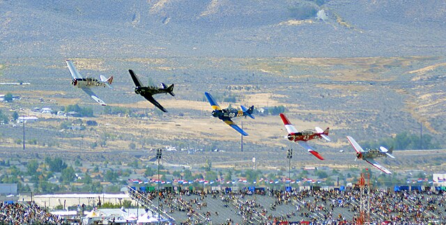 T-6 Gold Start passing the finish pylon at the 2014 Reno Air Races
