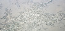 Olduvai Gorge from the air looking south, including view of museum.jpg