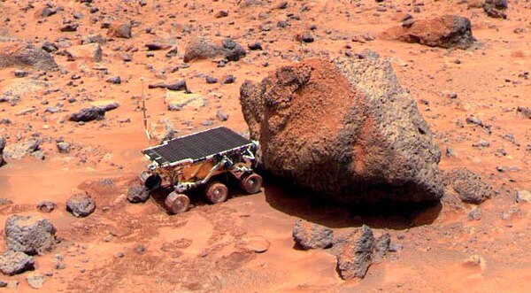 Sojourner takes Alpha Proton X-ray Spectrometer measurements of the Yogi Rock.
