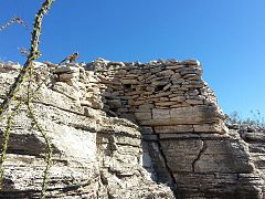 Part of the wall of the fort that surrounded the village. The holes in the wall are viewing holes so the defenders can view the only path to the top.