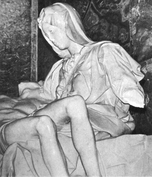 A detail view of the statue with damaged arm, nose and eye, May 1972.