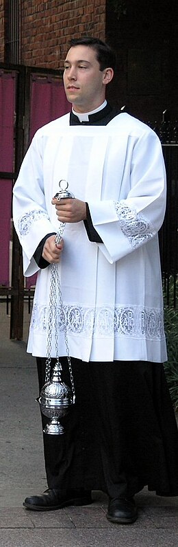 Priest or seminarian with thurible.jpg
