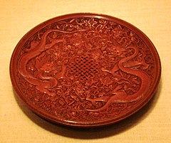 Ming dynasty red lacquerware dish with Chinese dragons and an endless knot