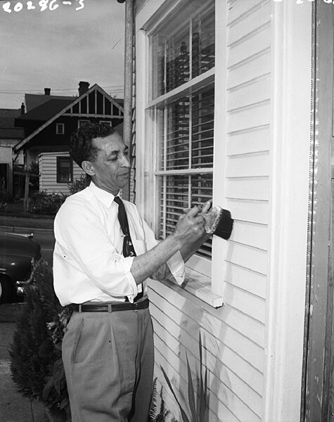 File:Seattle - Man painting house in urban renewal project, 1960 (52703394019).jpg