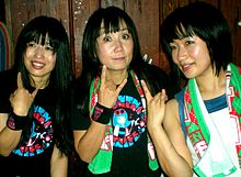 Shonen Knife posing for photos after a concert.jpg