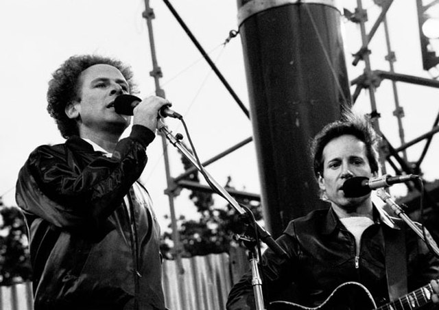 Garfunkel, left, with Paul Simon, right, performing outside at a concert in Dublin as Simon & Garfunkel