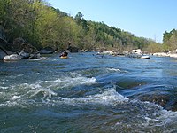 The St. Francis River rises in the granite mountains of the eastern Ozarks where it is a clear, rapid stream.