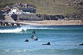 Surfers in sea at Sennen