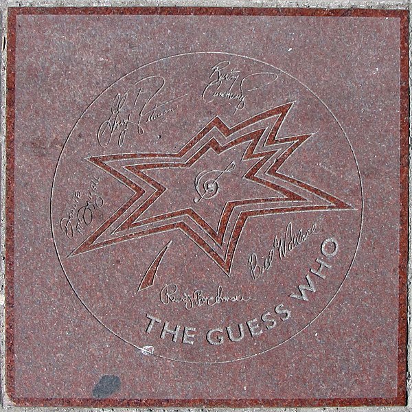 The band's star on Canada's Walk of Fame. Signatures, from top left clockwise: Garry Peterson, Burton Cummings, Bill Wallace, Randy Bachman, and Donni