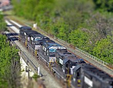 A digitally blurred image of a Norfolk Southern freight train Train tilt shift.jpg