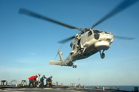 ไฟล์:U.S._Sailors_with_the_flight_deck_crew_aboard_the_guided_missile_destroyer_USS_Curtis_Wilbur_(DDG_54)_in_the_Gulf_of_Thailand_conduct_an_in-flight_refueling_simulation_with_a_Thai_Navy_S-70B_Seahawk_helicopter_130608-N-AX577-323.jpg