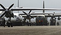 US Navy 070907-N-1810F-077 U.S. and Nicaraguan military personnel unload supplies from cargo aircraft during Hurricane Felix disaster relief operations.jpg