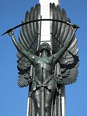 Part of the large memorial where a bronze angel bends the sword of war War Angel, Christchurch.jpg