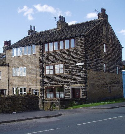 Former weavers' cottages in Wardle. An increase in domestic cloth production, and textile manufacture during the Industrial Revolution is attributed t