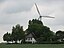 House in Oesterwurth-Wehren with wind turbine in background