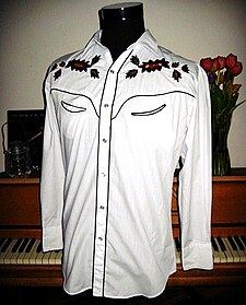 Man's Western shirt showing a shoulder yoke with applied decoration. Western shirt (1950s style).jpg