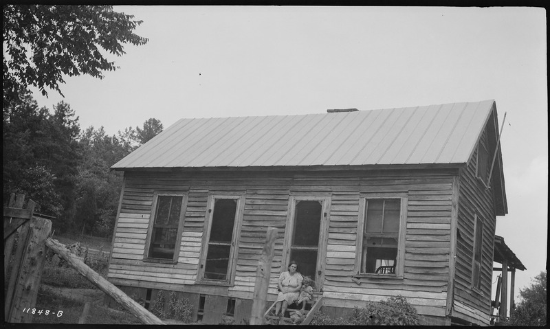 File:Williams, Lloyd, he, wife and daughter on front porch - NARA - 281282.tif