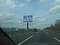 Sign for the upcoming Woodrow Wilson Service Area for both the car and truck lanes on the New Jersey Turnpike in April 2019.