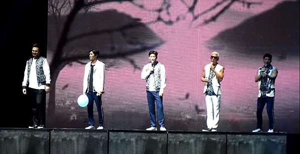 g.o.d performing at the 15th anniversary encore concert in October 2014