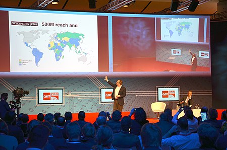 Fail:2014-03-14_CeBIT_Global_Conferences,_Jimmy_Wales,_Founder_Wikipedia,_(26)_On_stage_showing_the_world_for_Wikipedia_Zero_(500_millions),_while_Brent_Goff_is_still_listening.jpg