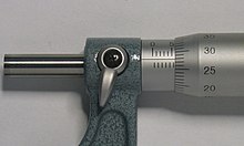 Micrometer thimble with a reading of 5.779 +- 0.005 mm. (You must enlarge the image to be able to read the scale to its fullest precision.) The reading consists of exactly 5.5 mm from the main scale plus an estimated 0.279 mm from the secondary scale. Assuming no zero error, this is also the measurement. 578metric-micrometer.jpg