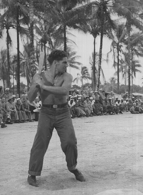 Rizzuto at bat in front of a group of US Navy Sailors in the South Pacific during his time in the US Navy between 1943 and 1945