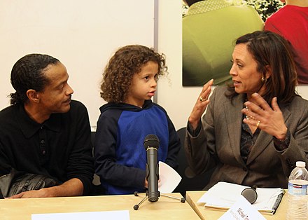 Harris meets foreclosure victims in 2011.