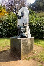 Statue of Alice Through the Looking Glass in the castle grounds Alice Looking Glass Guildford.jpg