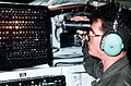 An electronic maintenance specialist with the 6949th Electronic Security Squadron checks equipment in the electronic security compartment of a 55th Strategic Reconnaissance Wing RC- - DPLA - f6975d1fcb84c0b0009ea21c049a33cd.jpeg