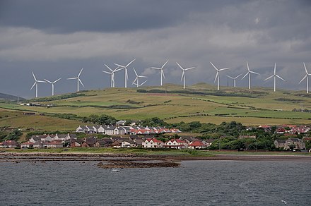 Wind turbines overlooking Ardrossan, Scotland. The UK is one of the best sites in Europe for wind energy, and wind power production is its fastest-growing supply.