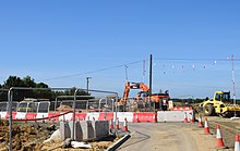 Baufahrzeuge arbeiten an der Southern Relief Road, Sommer 2018
