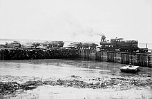 Locomotive circling log pond in Wilson City, 1905 Bahamas timber company locomotive.jpg